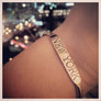 Hand stamped brass cuff "New York" on wrist