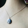Sterling silver starburst and turquoise round locket necklace