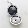 Sterling silver starburst and turquoise round locket necklace