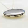 Sterling silver starburst and turquoise round locket necklace