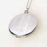 Sterling silver starburst and turquoise round locket necklace