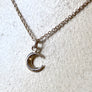 Small crescent moon pendant necklace