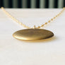Plain matte gold-shell round Victorian locket necklace