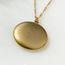 Plain matte gold-shell round Victorian locket necklace