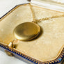 Plain matte gold-shell round Victorian locket necklace