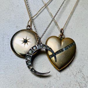 Antique crystal lockets, heart, moon, star.