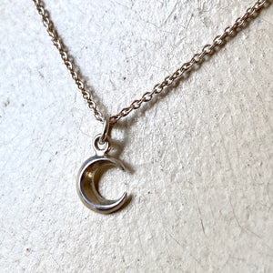 Small crescent moon pendant necklace