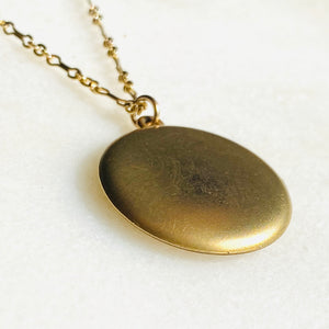 Plain matte gold-shell round Victorian locket necklace