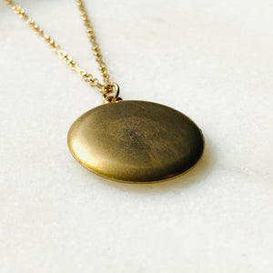 Plain matte gold-shell round Victorian locket necklace