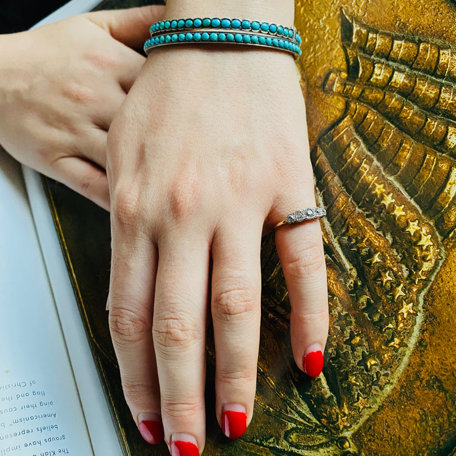 Graduated Five Diamond and Gold Antique Half-Hoop Ring
